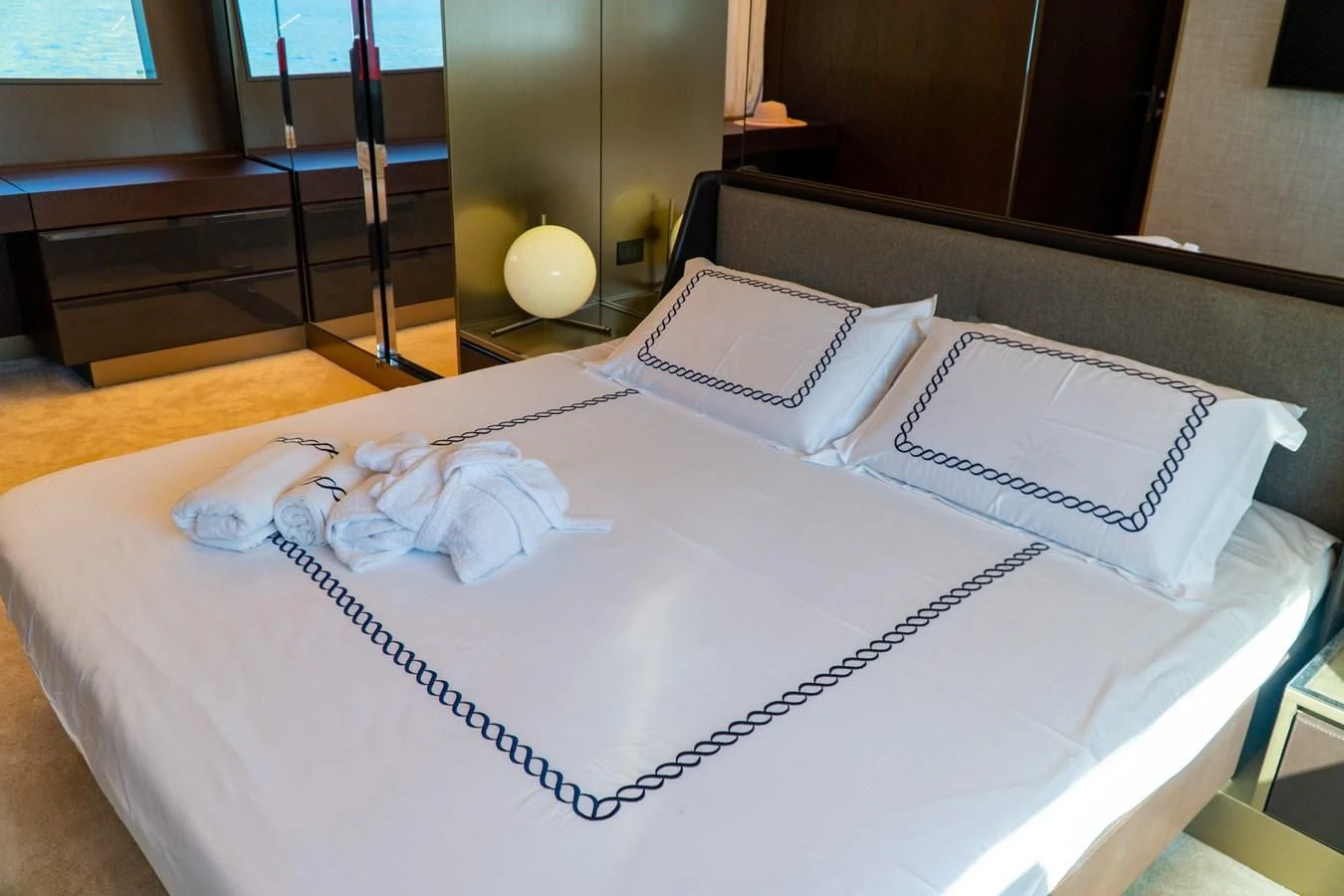 a white sheet of paper with a white ribbon on it aboard LADY G Yacht for Sale