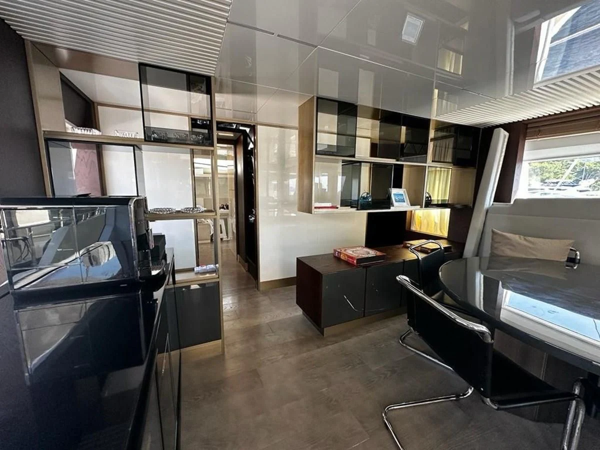 a room with desks and chairs aboard LADY G Yacht for Sale