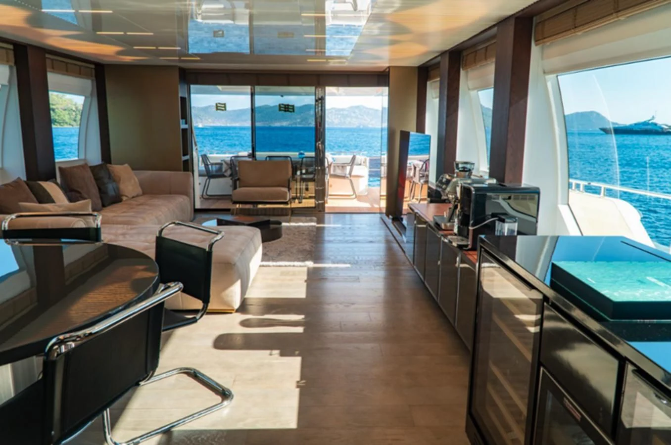 a living room with a large window aboard LADY G Yacht for Sale