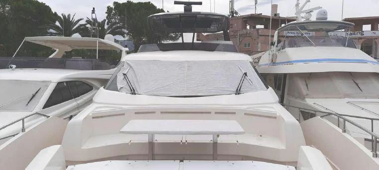a white car with a blue stripe aboard LADY G Yacht for Sale