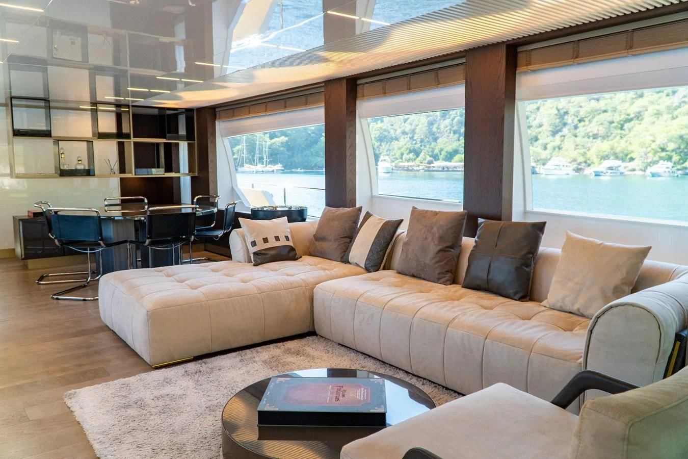 a living room with a couch and a table aboard LADY G Yacht for Sale