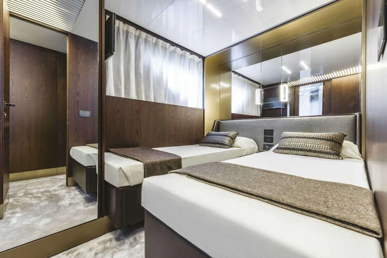 a room with two beds aboard LADY G Yacht for Sale