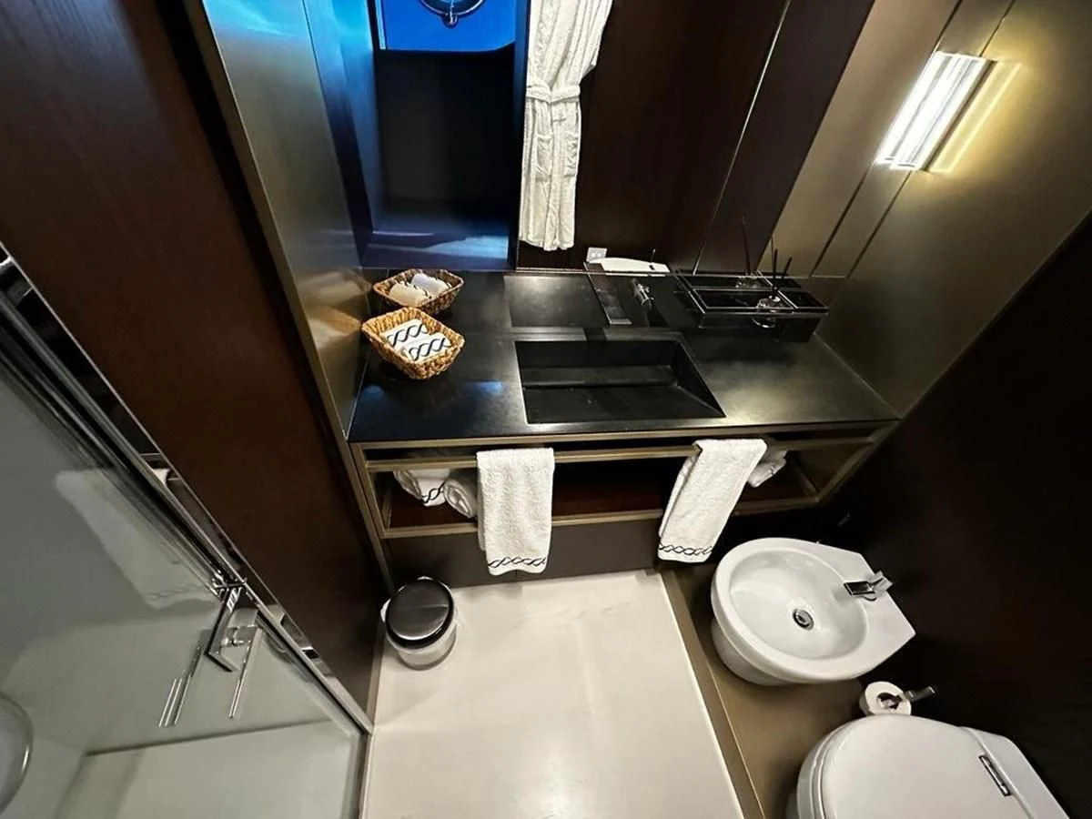 a kitchen with a sink and a mirror aboard LADY G Yacht for Sale