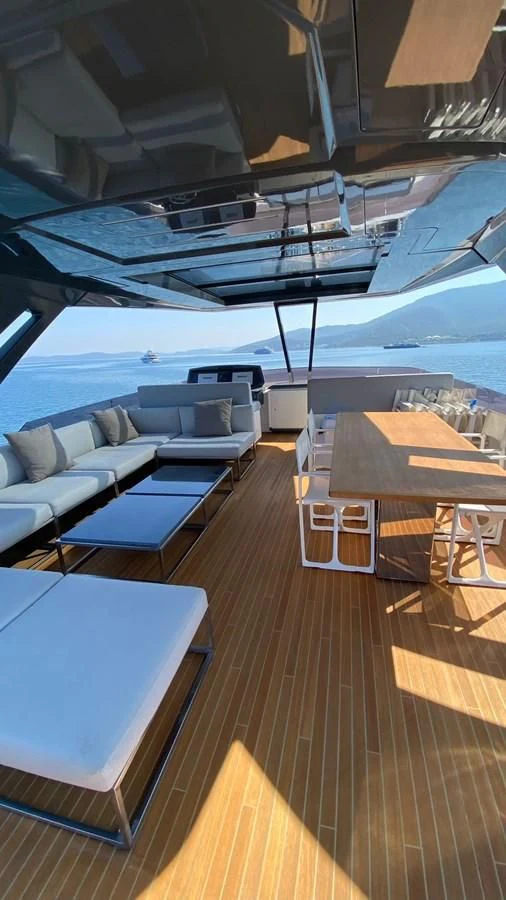 a boat with a table and chairs aboard LADY G Yacht for Sale