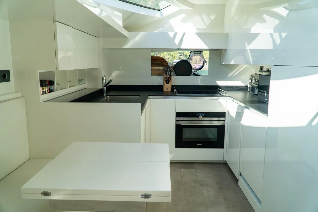 a kitchen with white cabinets aboard LADY G Yacht for Sale