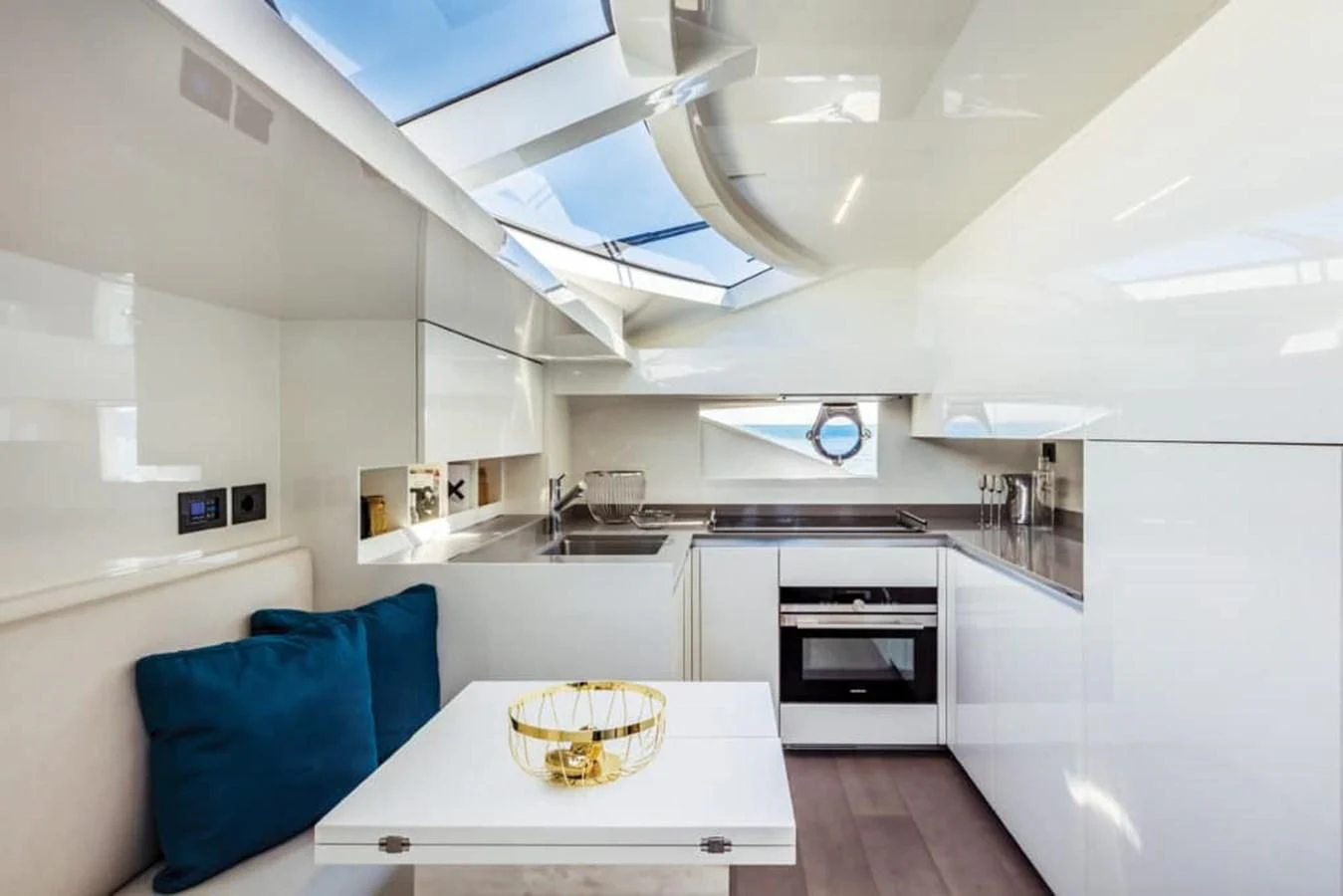 a kitchen with a table and a couch aboard LADY G Yacht for Sale