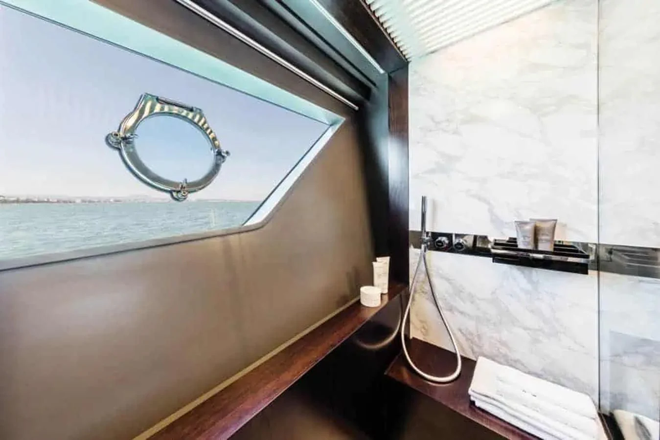 a black and white guitar leaning against a wall aboard LADY G Yacht for Sale