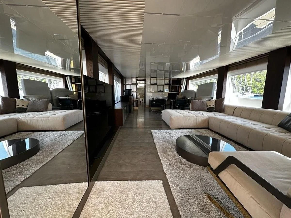 a living room with a large glass door aboard LADY G Yacht for Sale