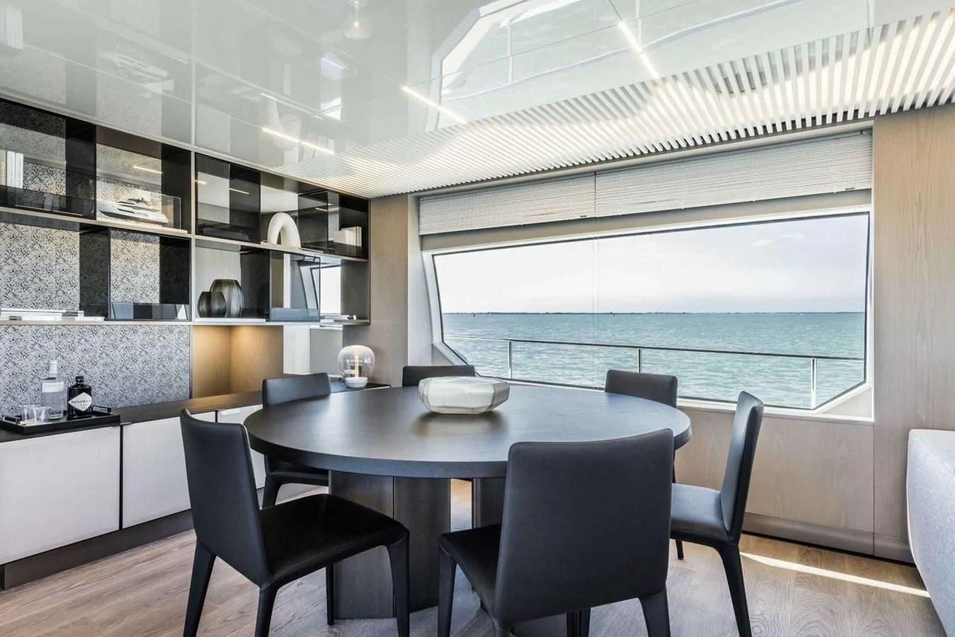 a room with a table and chairs aboard LADY G Yacht for Sale