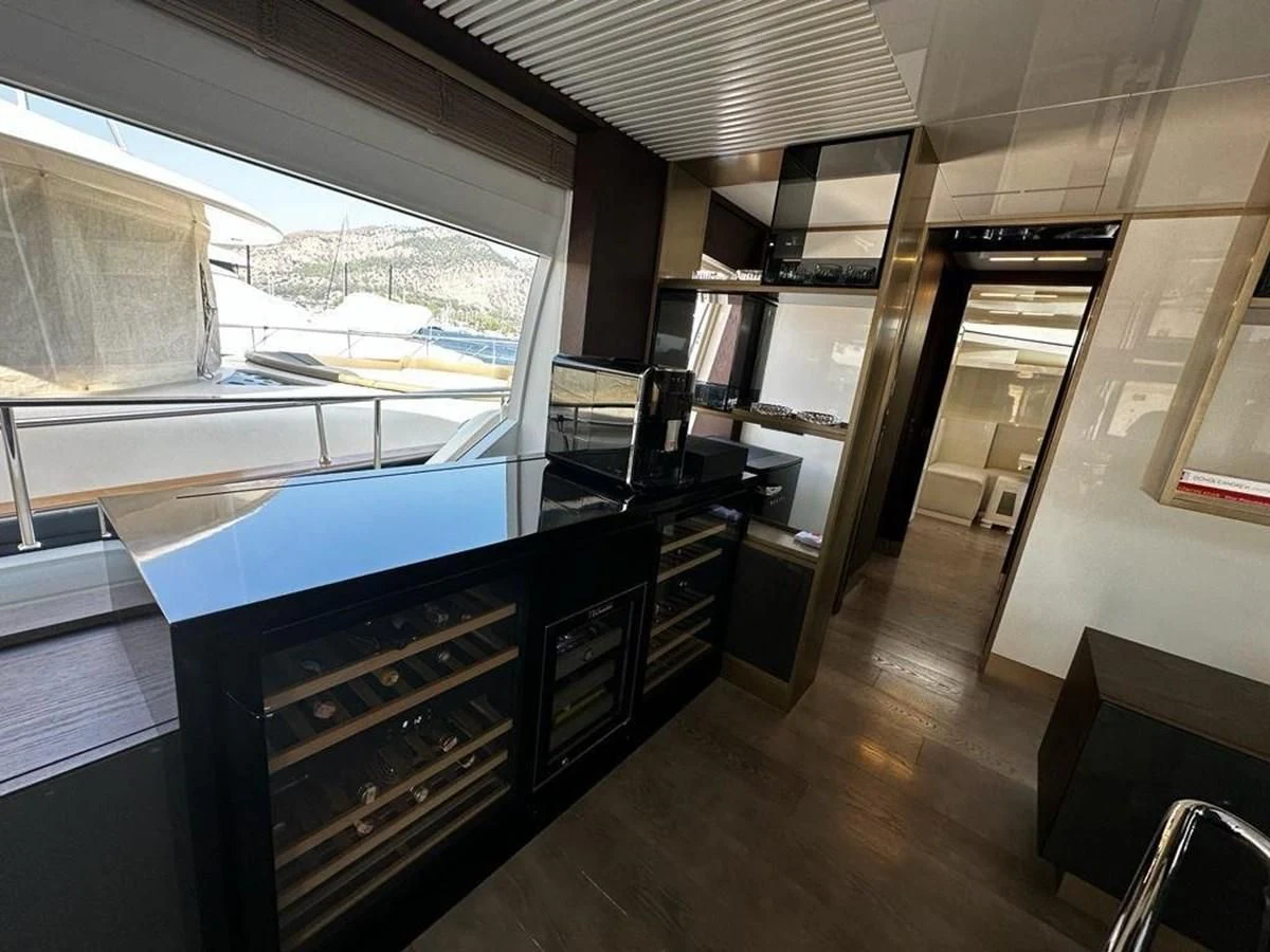 a room with a large window and a desk with a computer aboard LADY G Yacht for Sale
