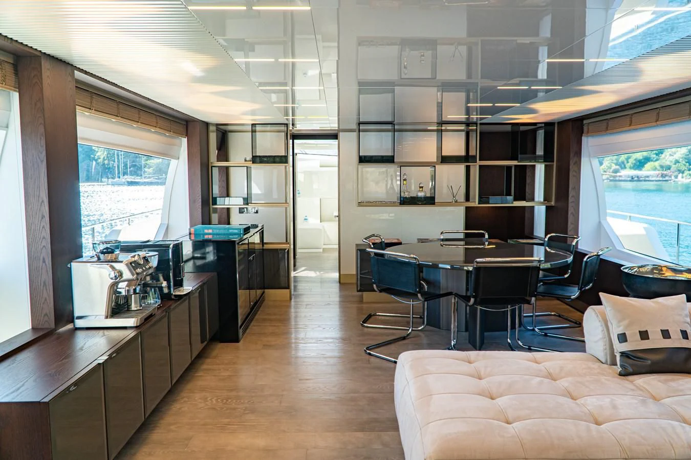 a room with a table chairs and a window aboard LADY G Yacht for Sale