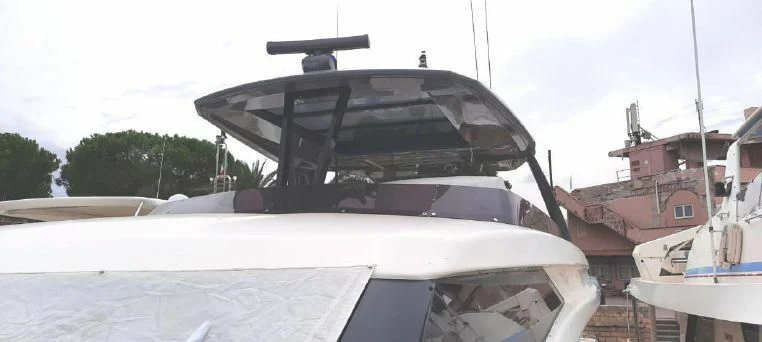 a white boat with a black roof aboard LADY G Yacht for Sale