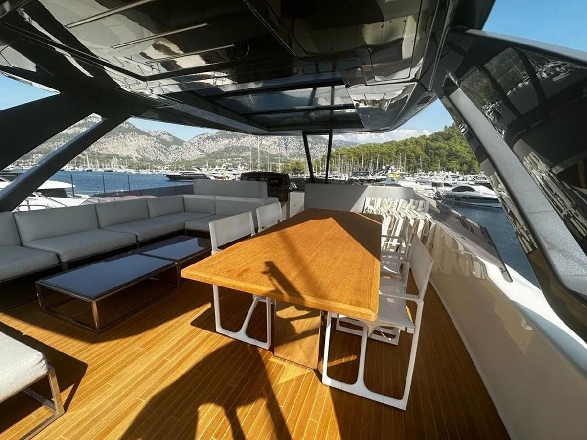 a room with a table and chairs aboard LADY G Yacht for Sale