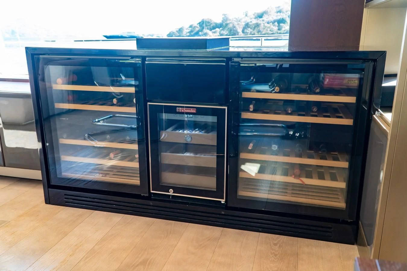 a large glass case with a door open aboard LADY G Yacht for Sale