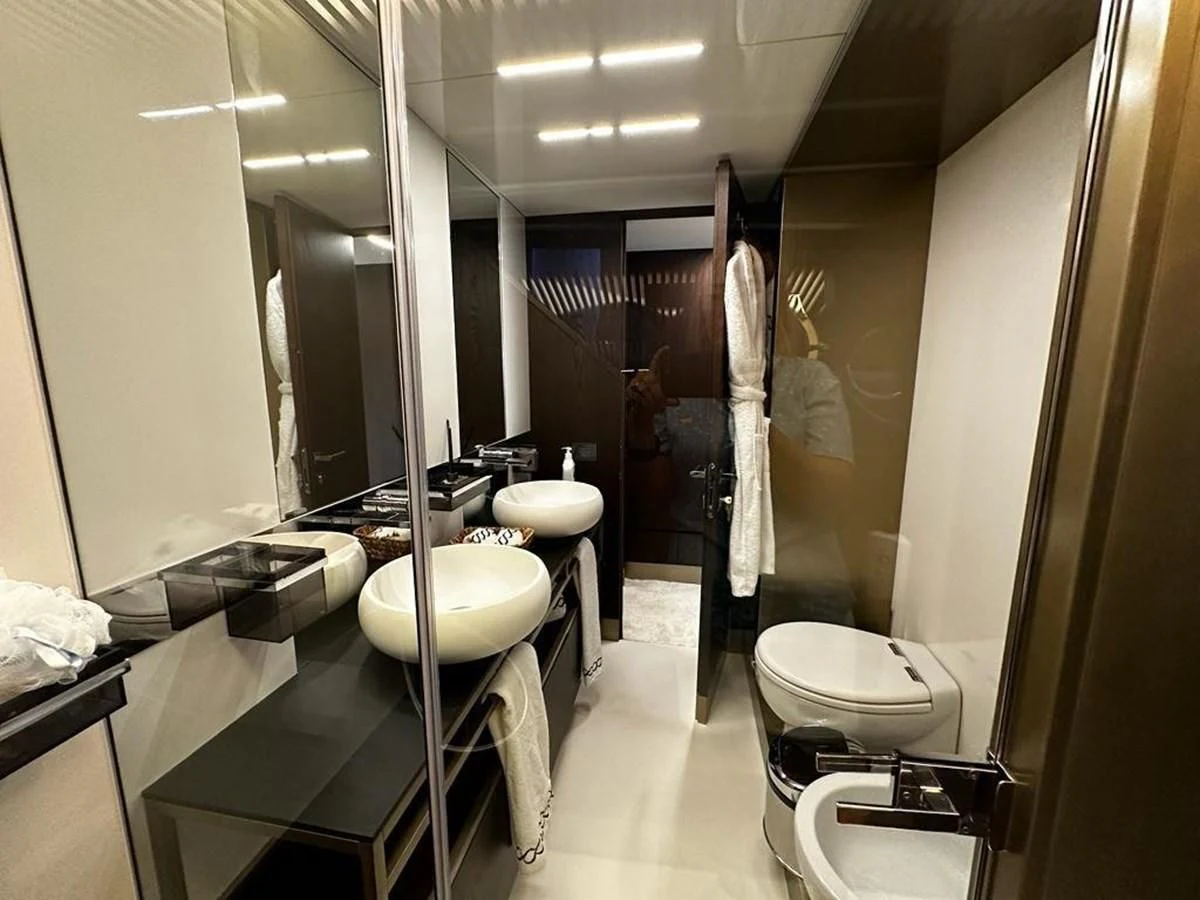 a bathroom with a large mirror aboard LADY G Yacht for Sale