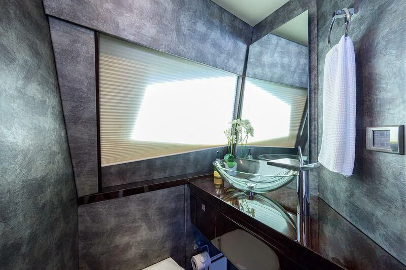 a bathroom with a sink and a window aboard LADY NADIA Yacht for Sale