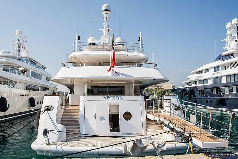 a large white boat in a harbor aboard VECTOR Yacht for Sale