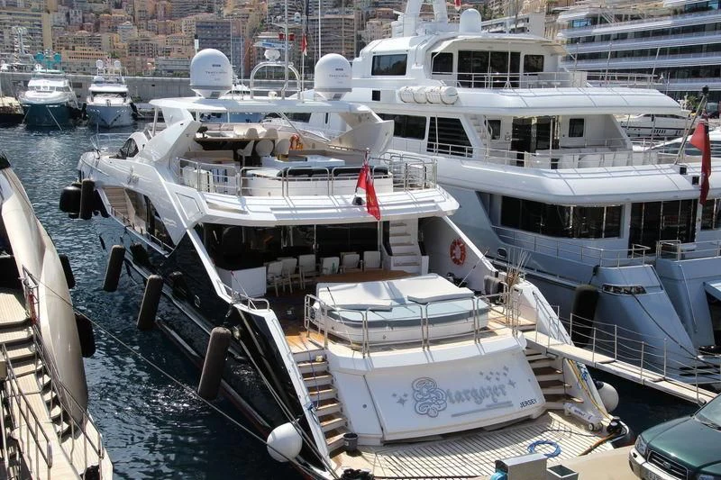a boat docked at a pier aboard STARGAZER Yacht for Sale
