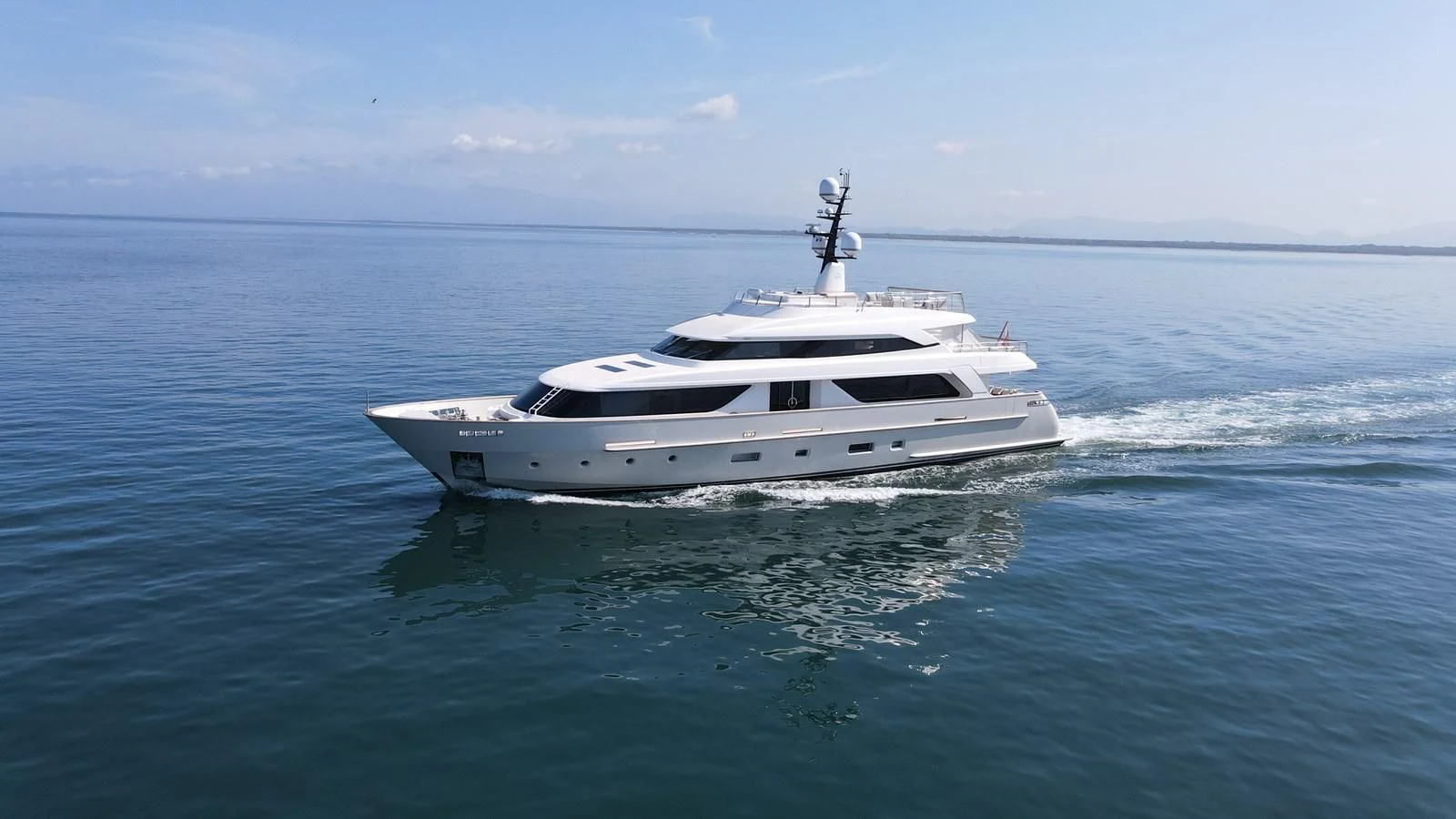 a white yacht in the water aboard NAYA 7 Yacht for Sale