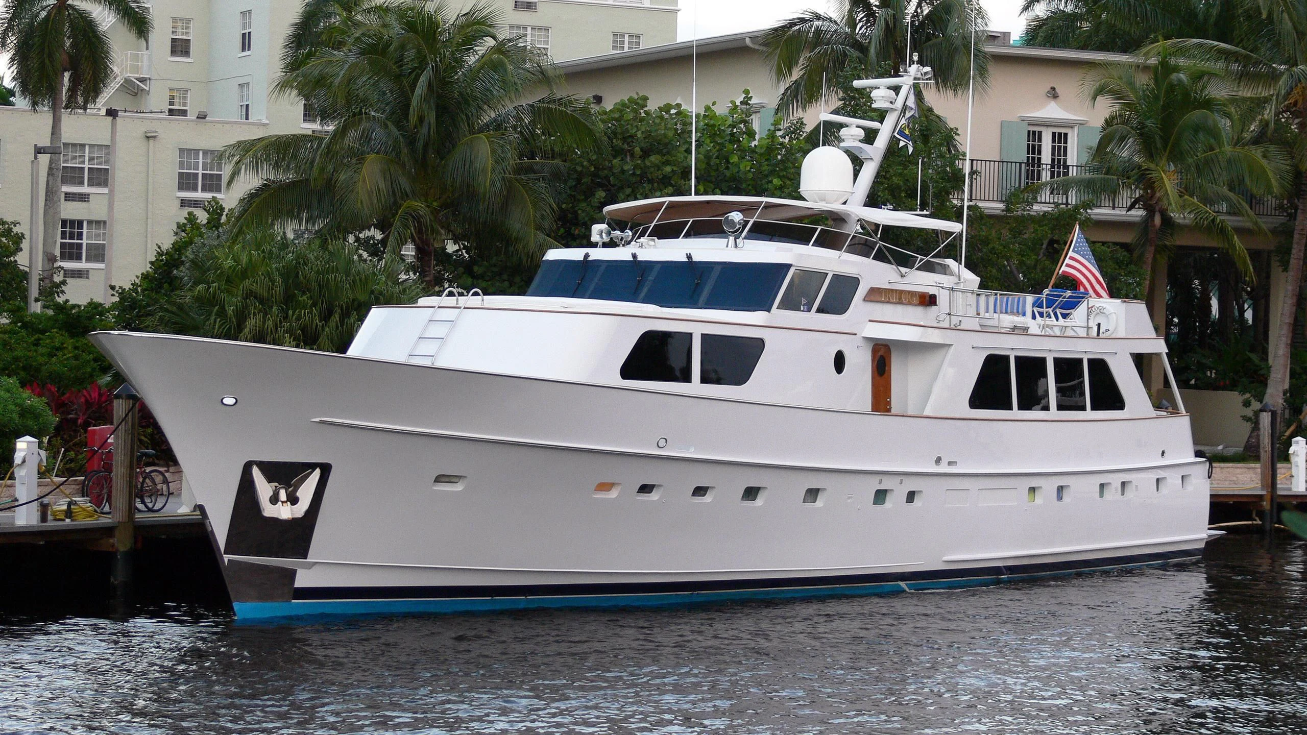 a white boat on the water aboard TRILOGY Yacht for Sale