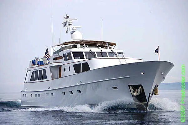 a large white boat aboard TRILOGY Yacht for Sale