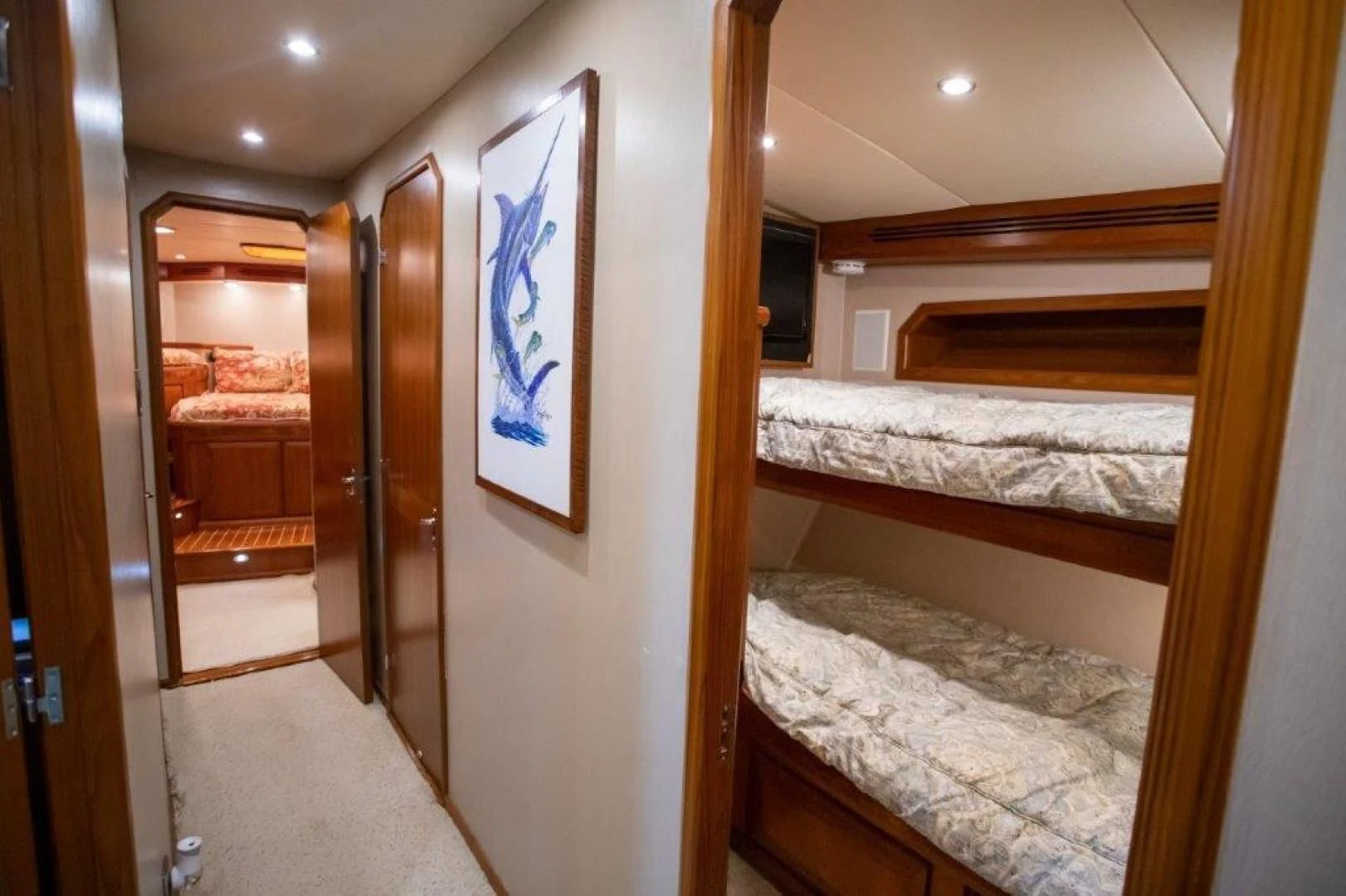 a room with a bed and a door aboard PULLIN WIRE Yacht for Sale