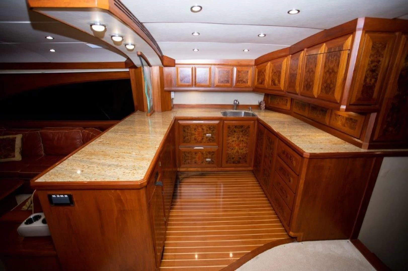 a large kitchen with wooden cabinets aboard PULLIN WIRE Yacht for Sale