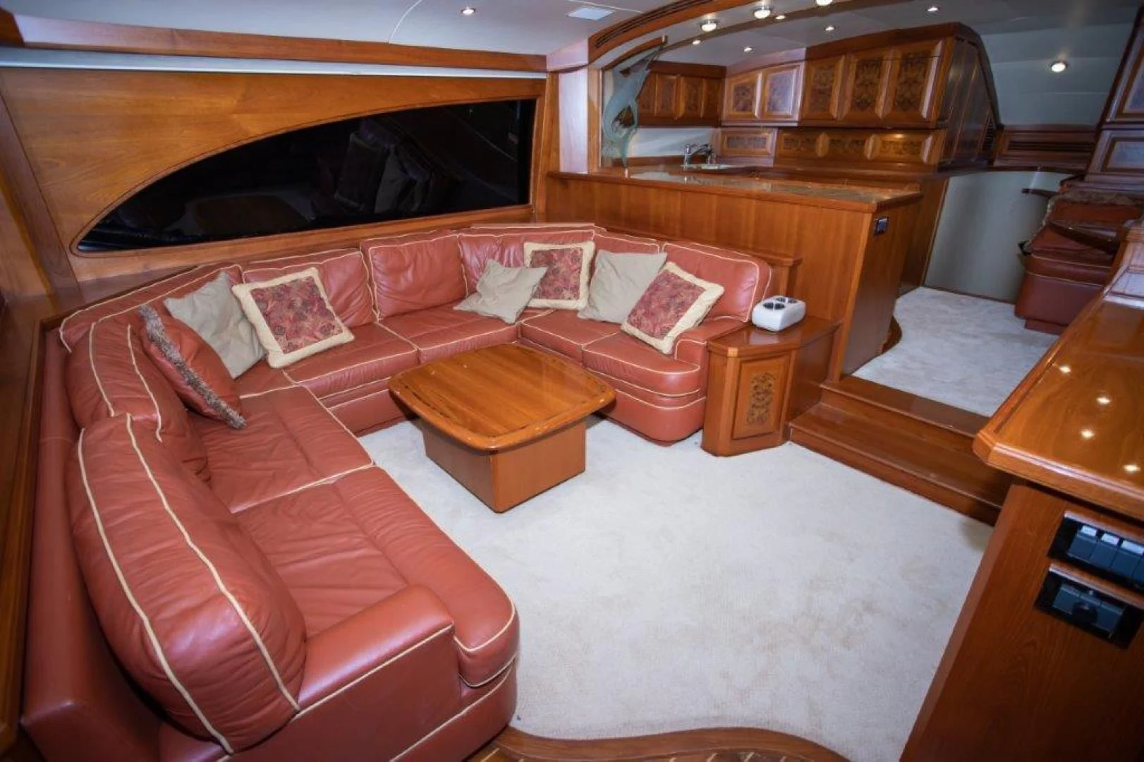 a living room with a couch and a table aboard PULLIN WIRE Yacht for Sale