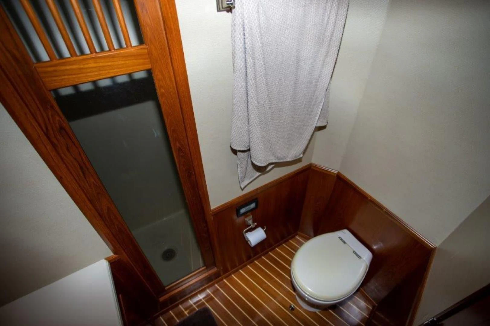 a bathroom with a toilet and a sink aboard PULLIN WIRE Yacht for Sale
