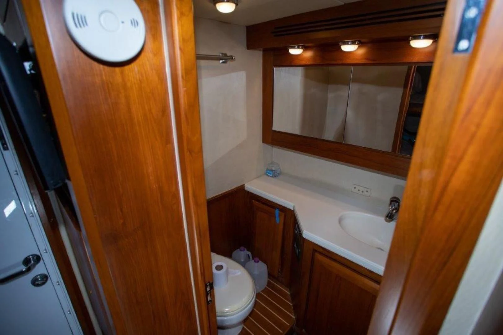 a bathroom with a toilet and sink aboard PULLIN WIRE Yacht for Sale