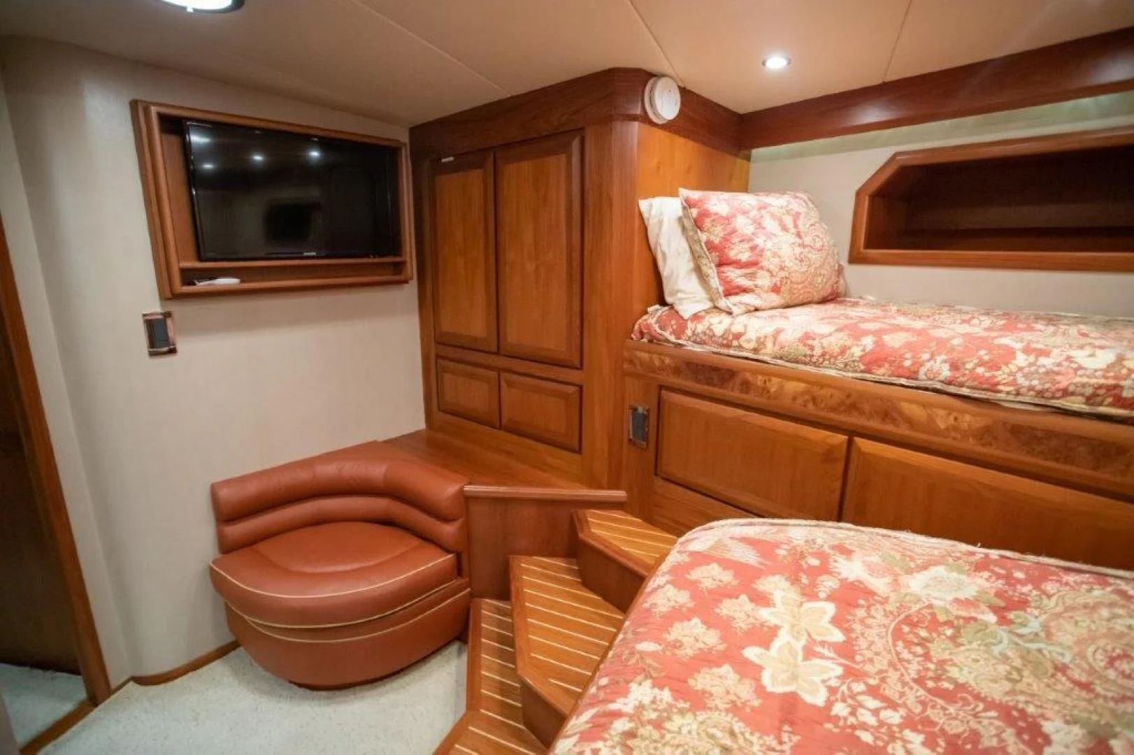 a room with a bed and a television aboard PULLIN WIRE Yacht for Sale