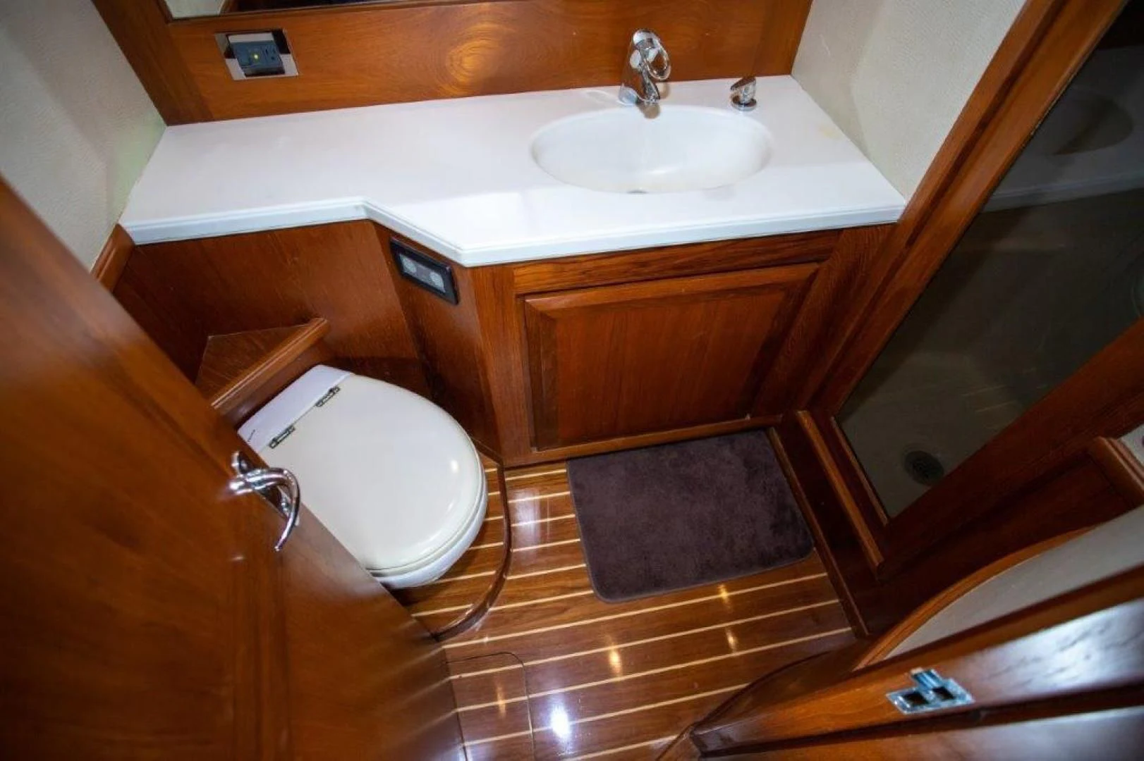 a bathroom with a sink and a toilet aboard PULLIN WIRE Yacht for Sale