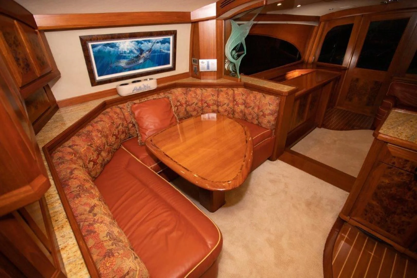 a living room with a couch and a table aboard PULLIN WIRE Yacht for Sale