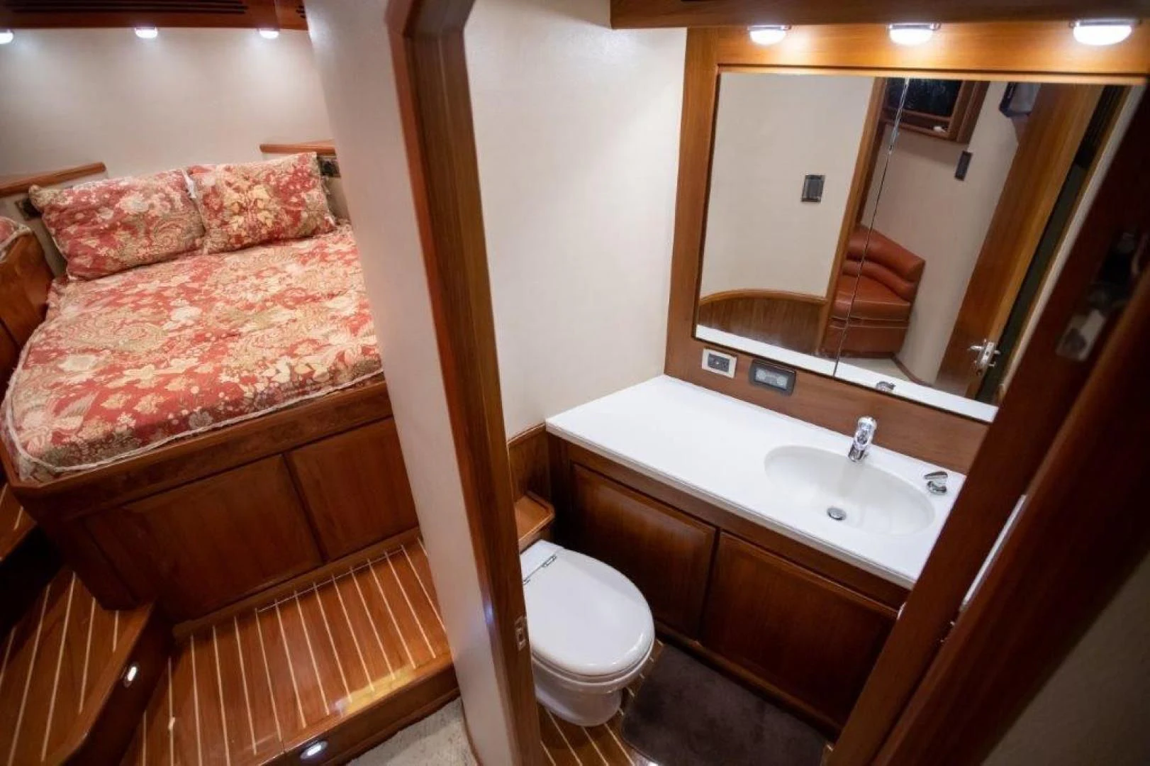 a bathroom with a bed and a sink aboard PULLIN WIRE Yacht for Sale
