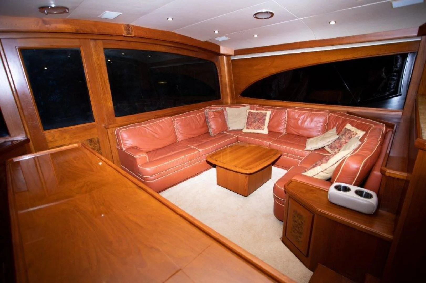 a living room with a couch and a coffee table aboard PULLIN WIRE Yacht for Sale