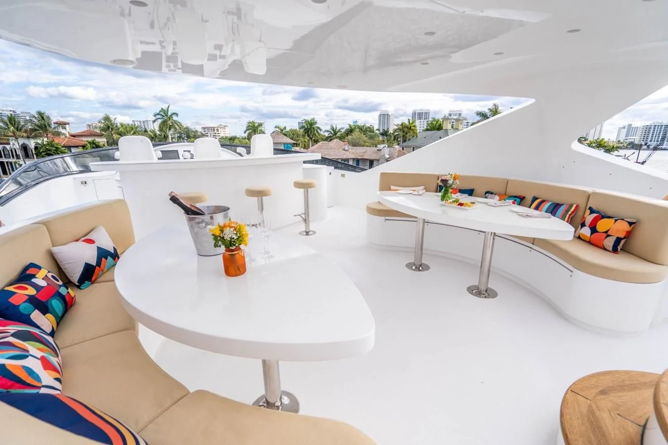 a table and chairs on a balcony aboard TRUE NORTH Yacht for Sale