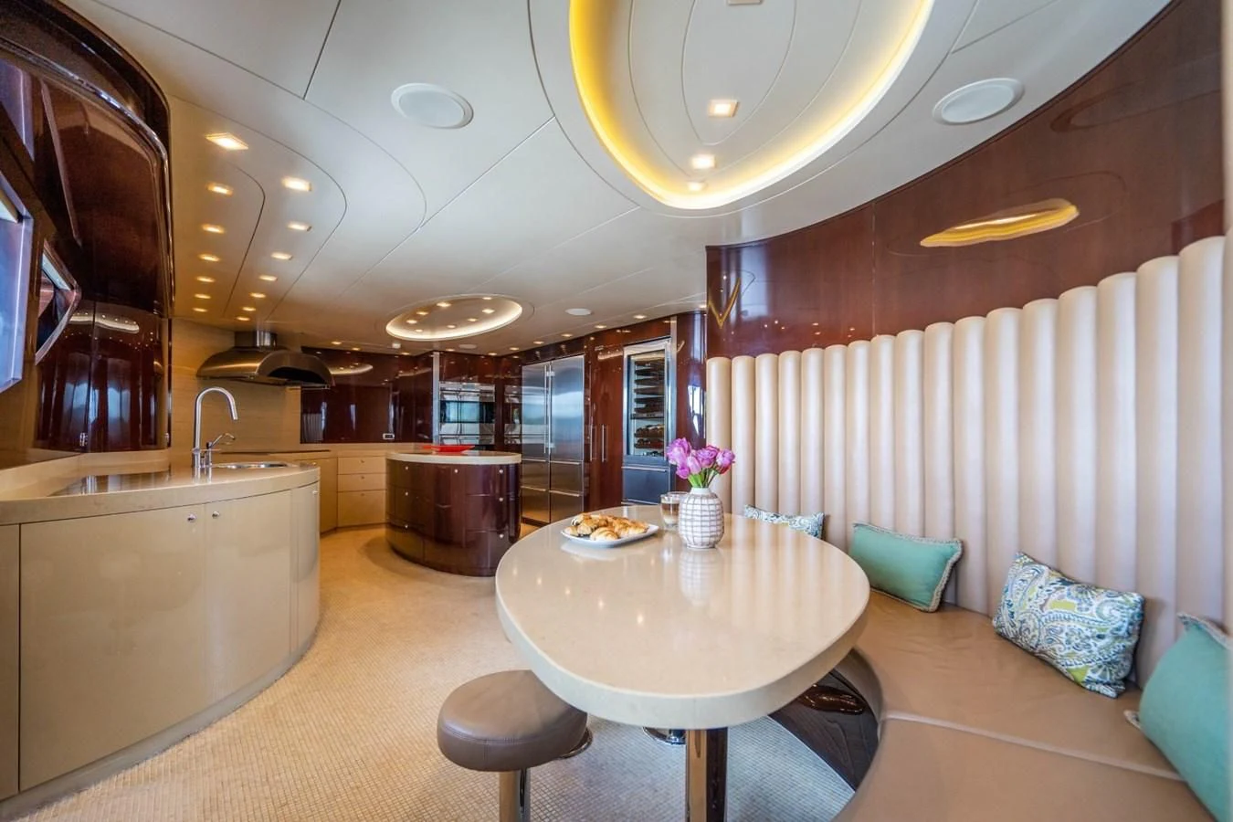 a large kitchen with a table aboard TRUE NORTH Yacht for Sale