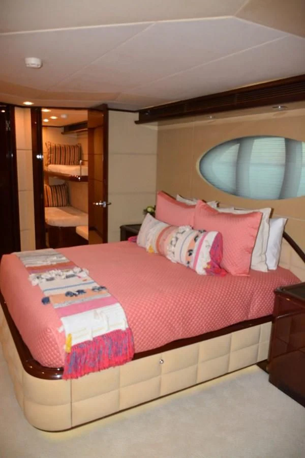 a bed with pink sheets aboard TRUE NORTH Yacht for Sale