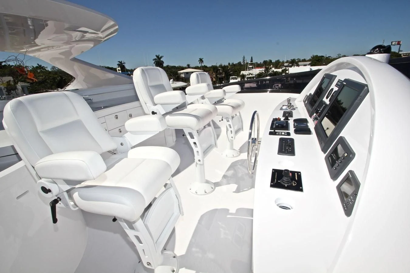 a group of white chairs in a row aboard TRUE NORTH Yacht for Sale
