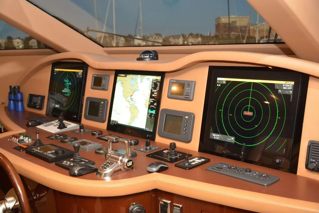 a control panel with multiple monitors aboard TRUE NORTH Yacht for Sale