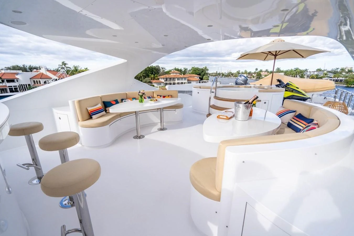 a table and chairs on a patio aboard TRUE NORTH Yacht for Sale
