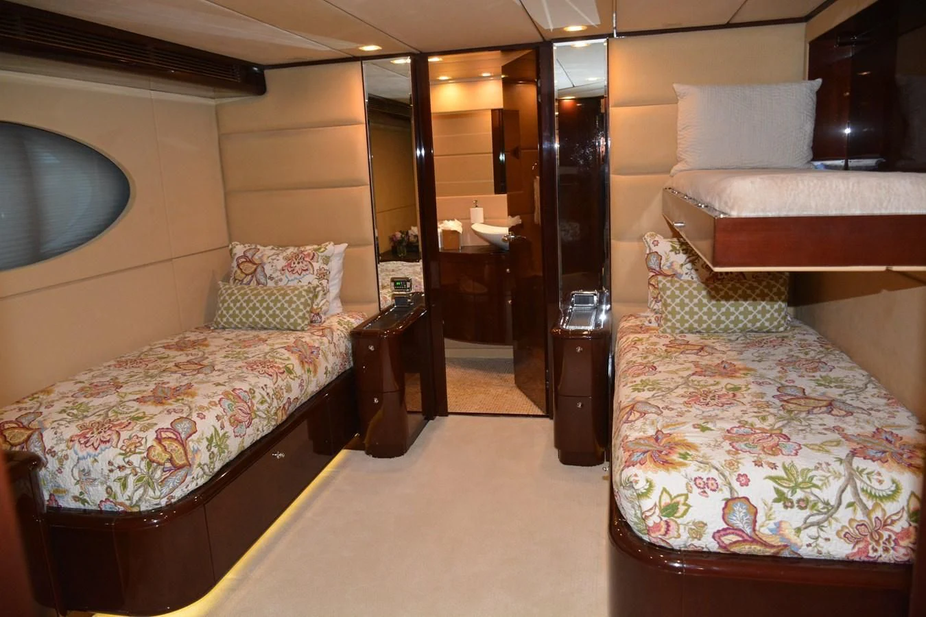a room with a bed and a mirror aboard TRUE NORTH Yacht for Sale