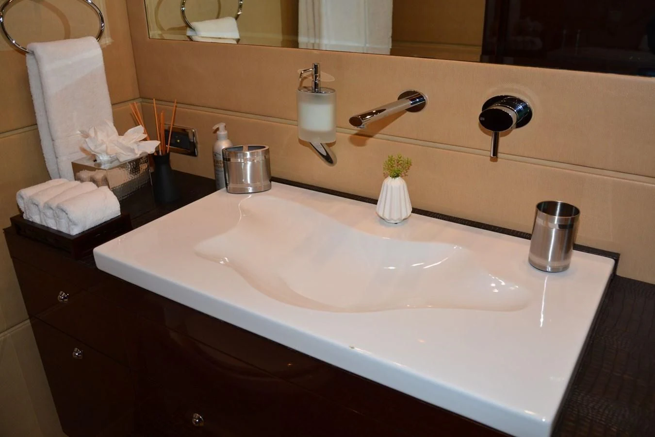 a bathroom sink with soap dispensers aboard TRUE NORTH Yacht for Sale