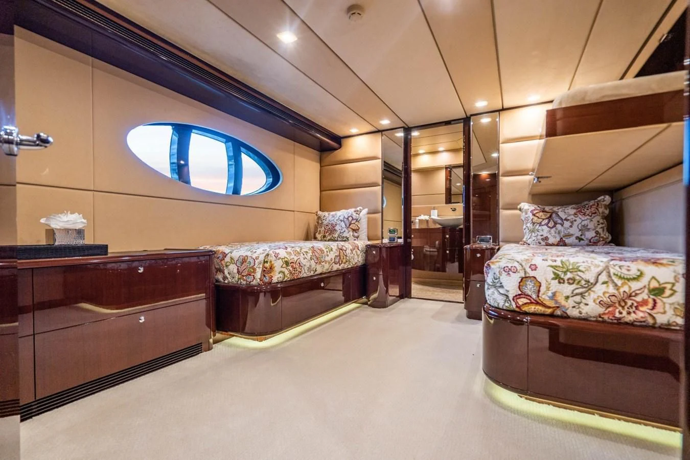 a room with a bed and a couch aboard TRUE NORTH Yacht for Sale