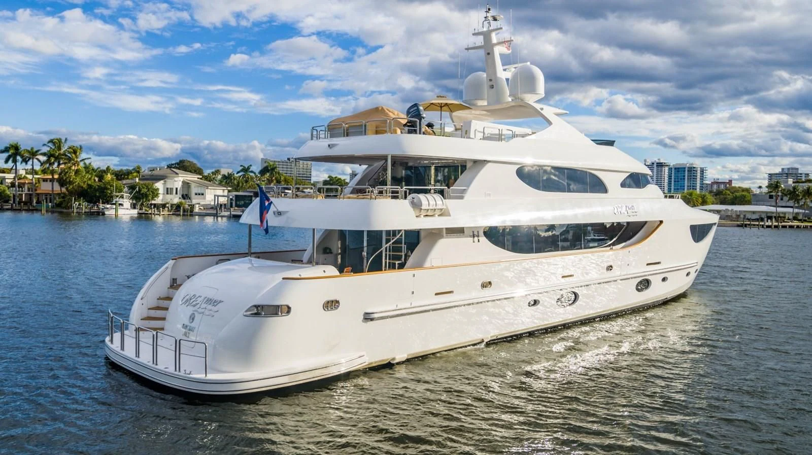a large white boat on the water aboard TRUE NORTH Yacht for Sale