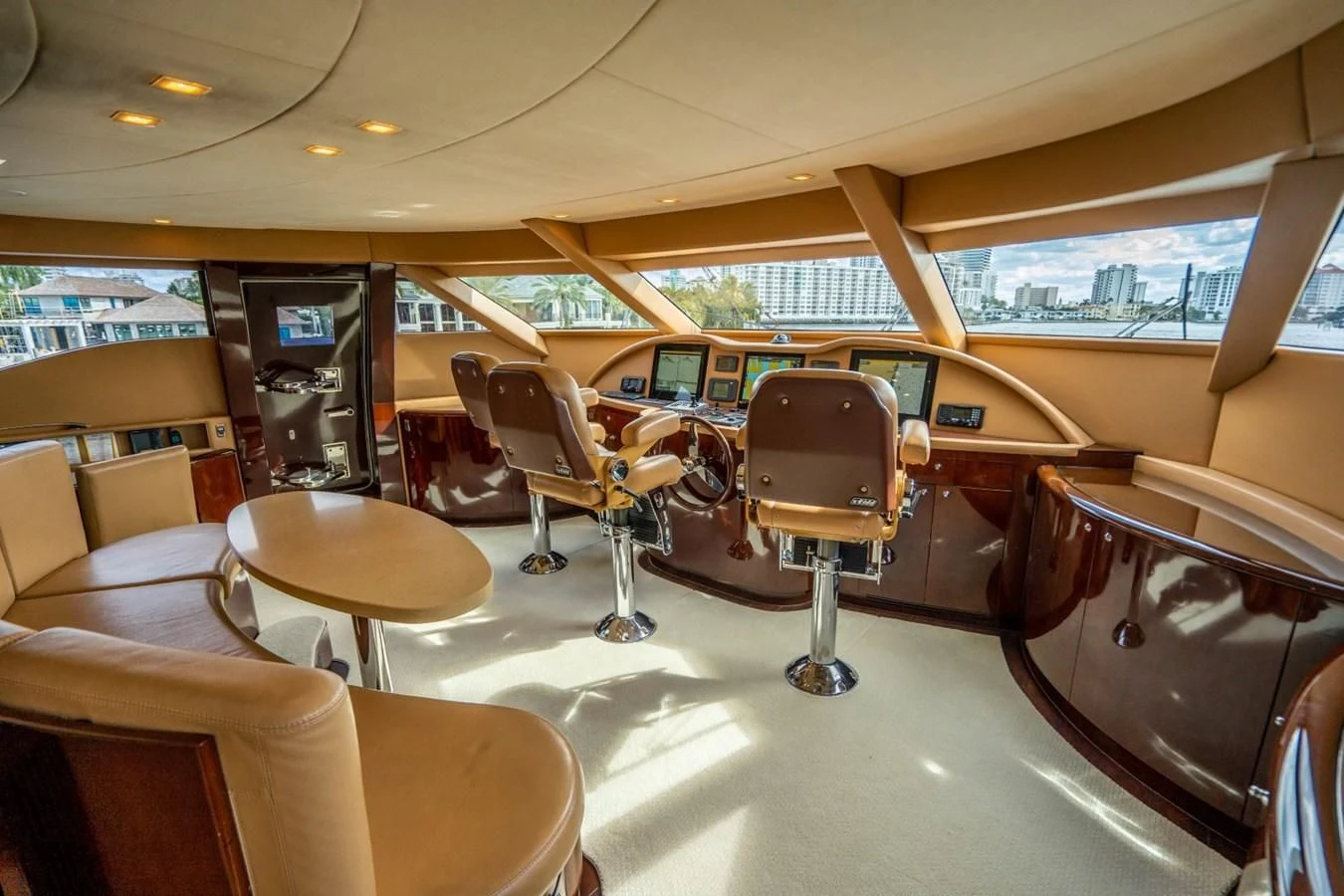 inside of a vehicle with chairs and tables and a large window aboard TRUE NORTH Yacht for Sale