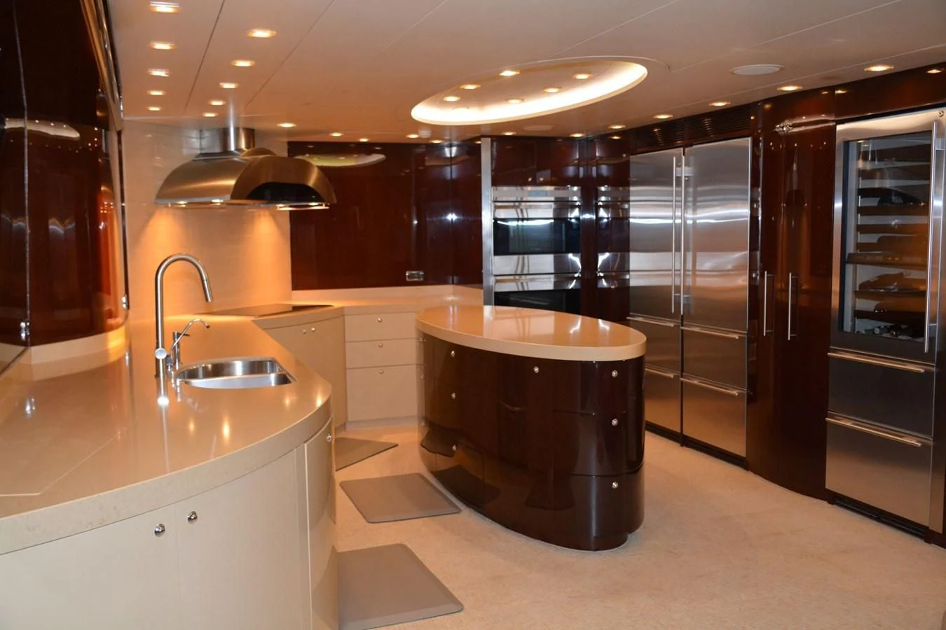 a large kitchen with a large island aboard TRUE NORTH Yacht for Sale