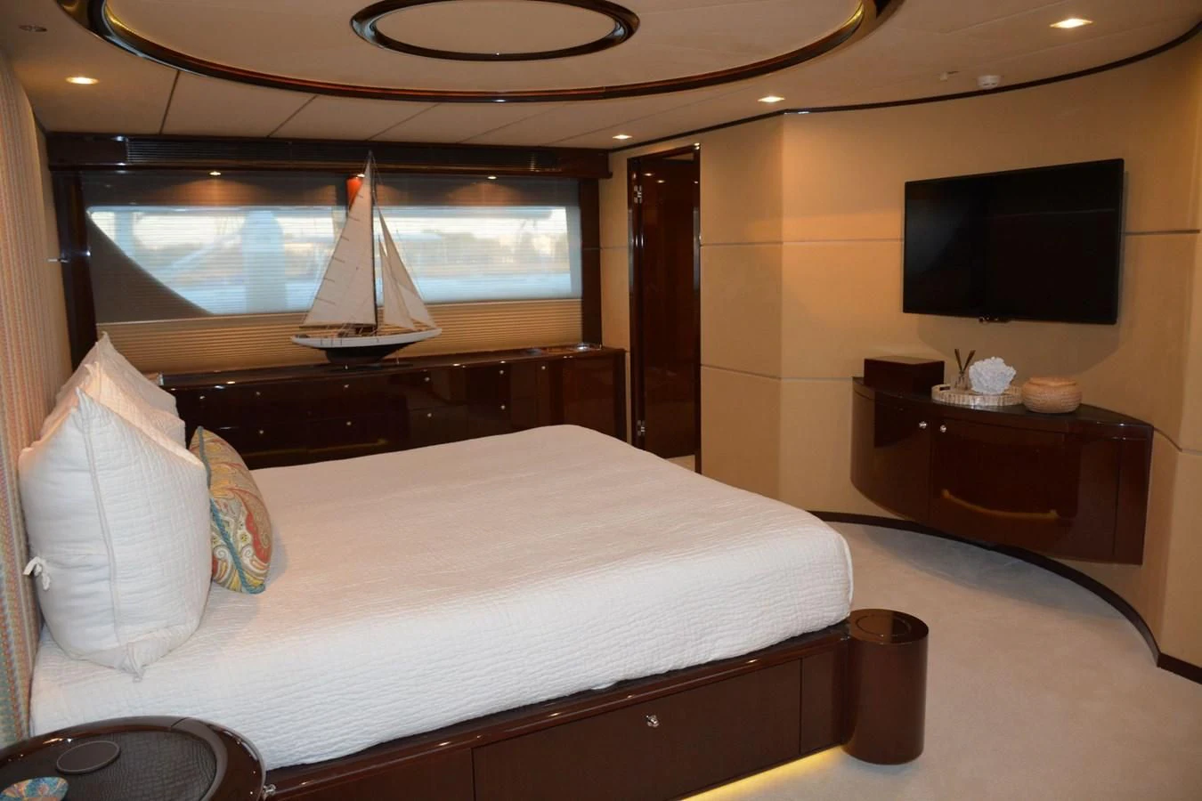 a hotel room with a bed and a television aboard TRUE NORTH Yacht for Sale