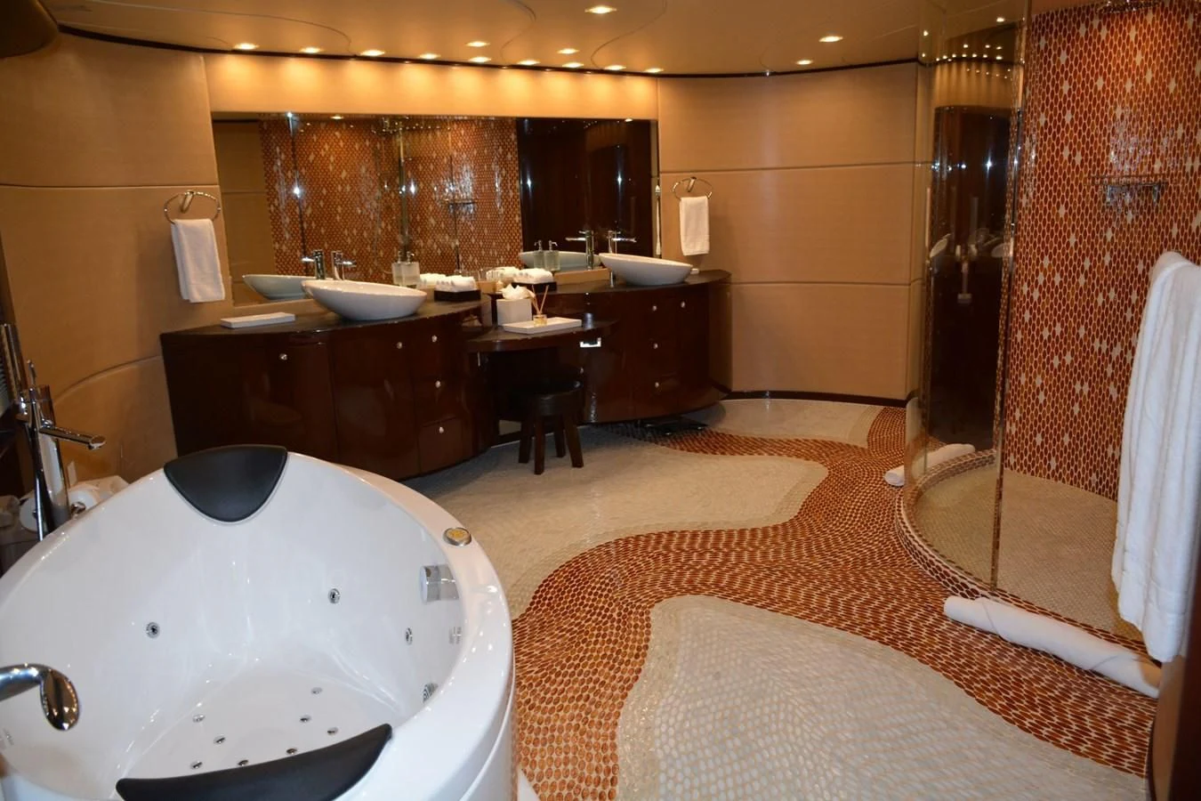 a bathroom with a bathtub sink and a sink aboard TRUE NORTH Yacht for Sale