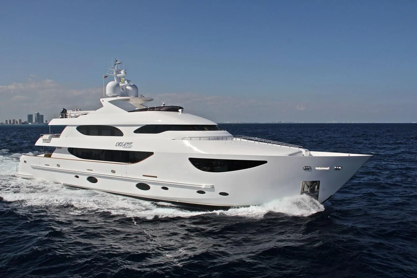 a white yacht on the water aboard TRUE NORTH Yacht for Sale